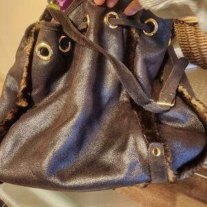 Elegant Brown Bucket Bag with Gold Accents